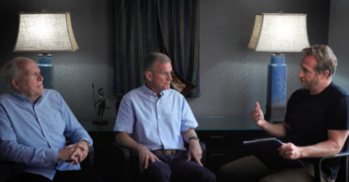 John Brennan Stan McChrystal and Jake Harriman looking at each other during a fireside chat